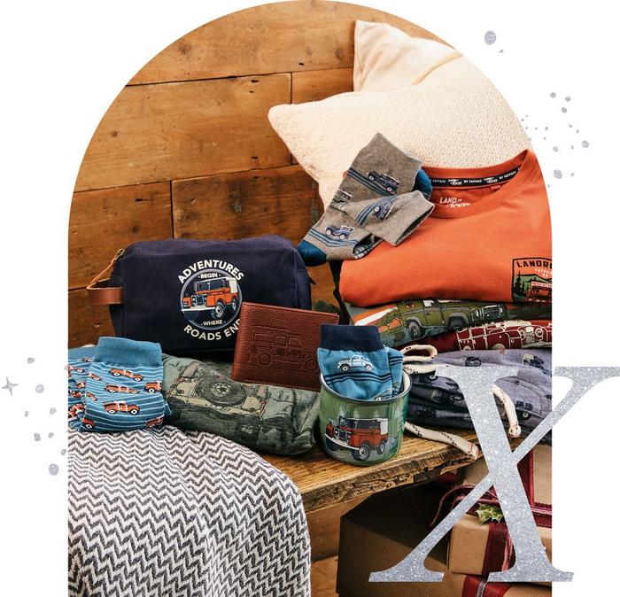 A selection of accessories with Land Rover designs, including a washbag, wallet, mug, socks, T-shirts & lounge pants.