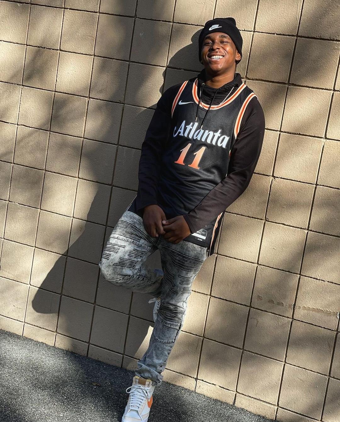 Black Nike beanie, Nike Jersey, and men's denim