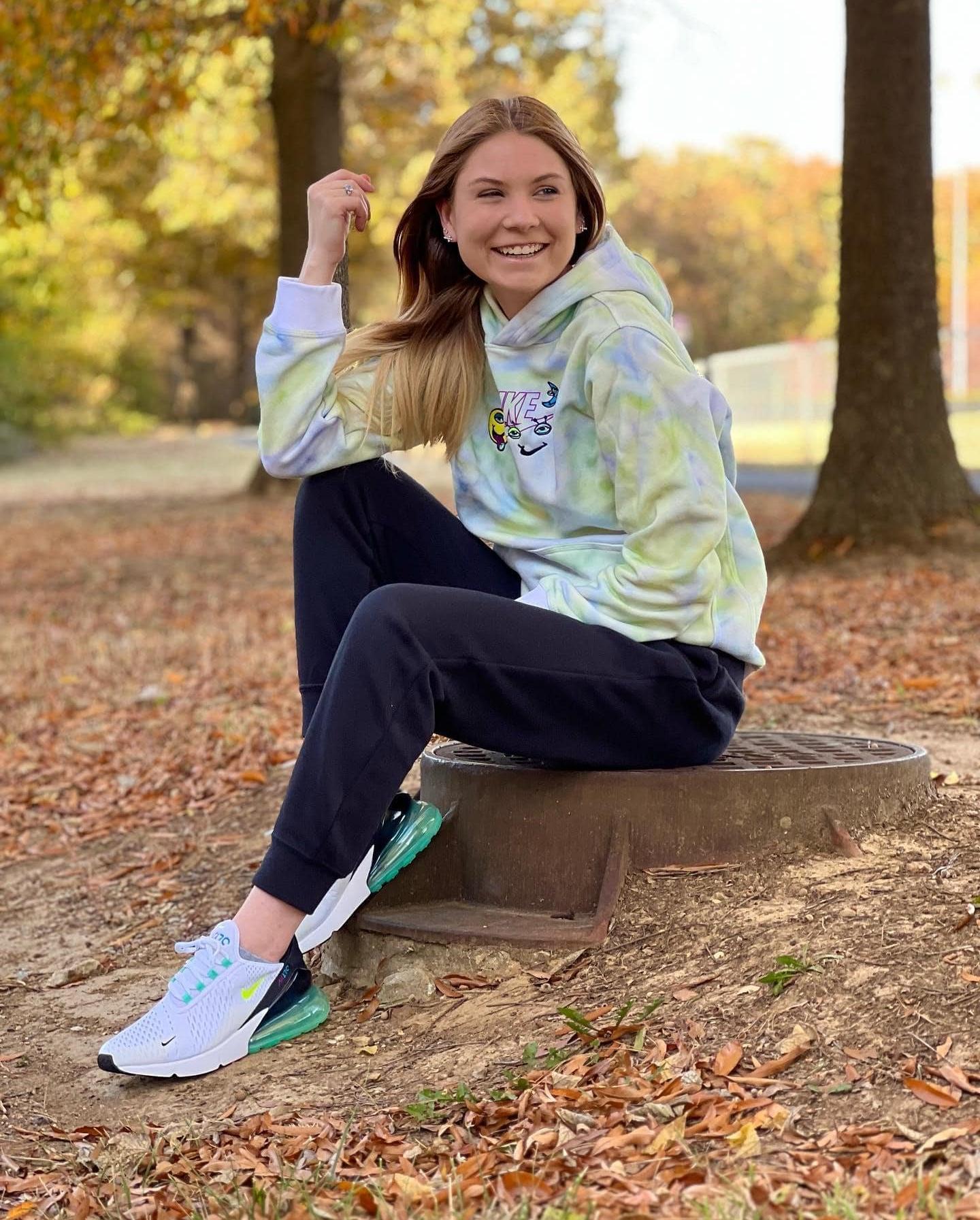 Woman in Nike Apparel and Sneakers