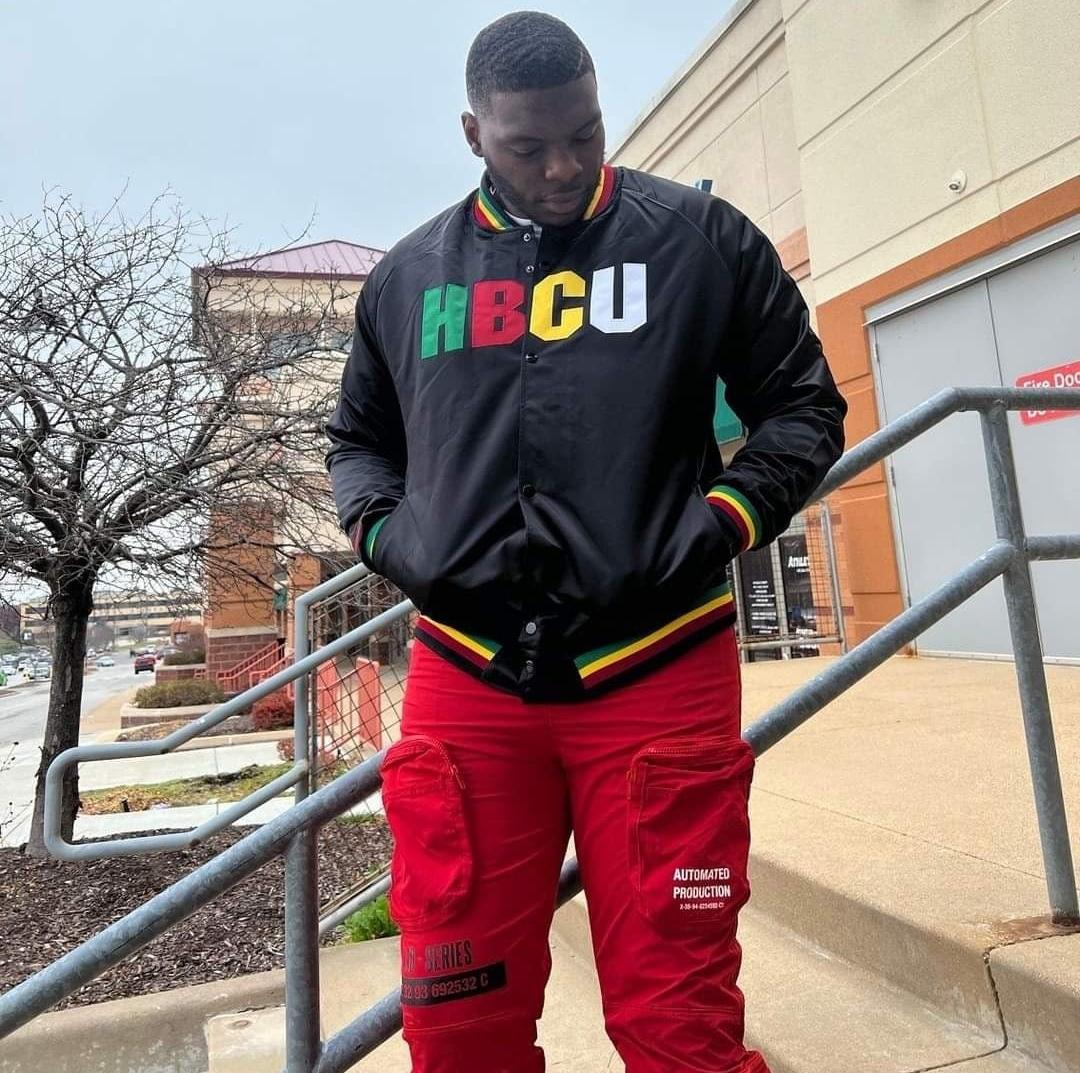 Man in Red Cargo/ Utility Pants and HBCU Jacket 