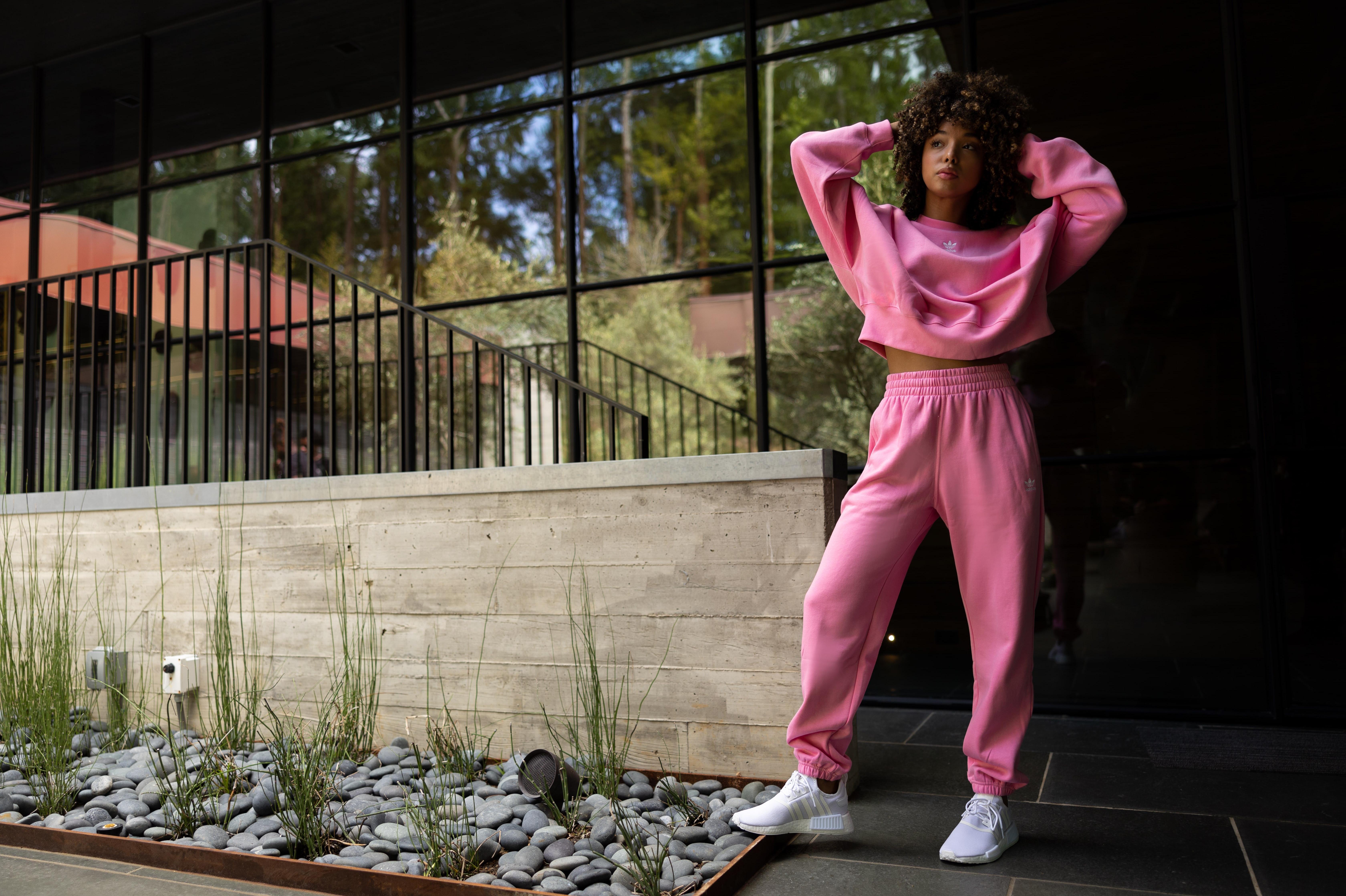 woman in adidas pink apparel