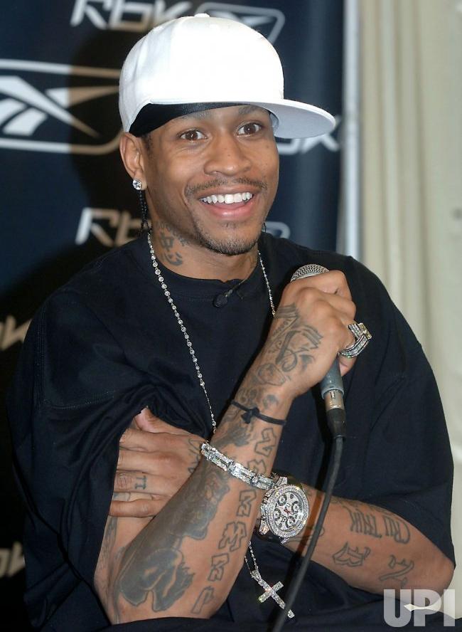 Allen Iverson with jewelry, oversized shirt, and hat- courtesy of https://www.upi.com/