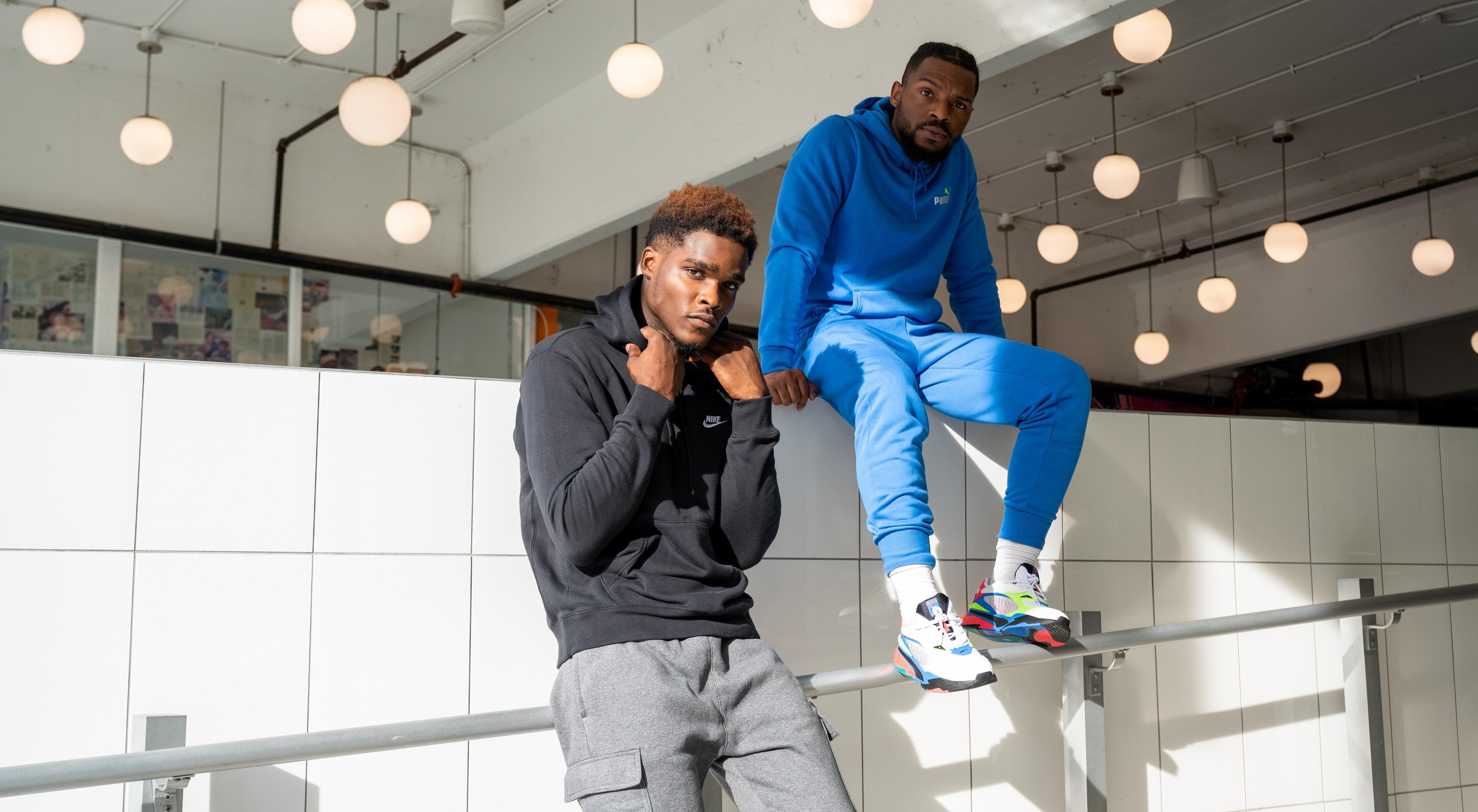 Two men in fleece hoodies and joggers