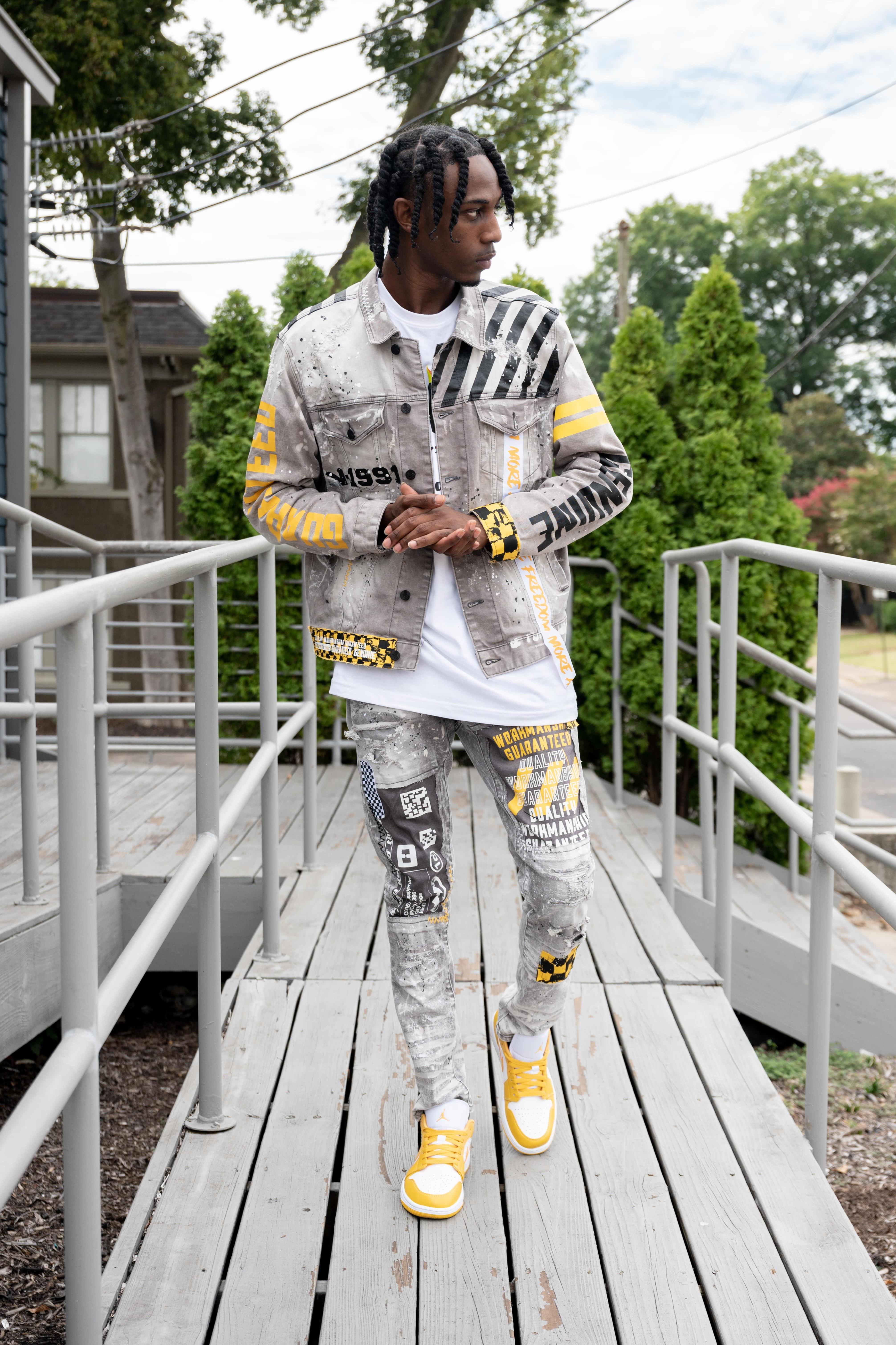 Man in low Jordan 1s, Smoke Rise jeans, white tee shirt, and Smoke Rise denim Jacket.