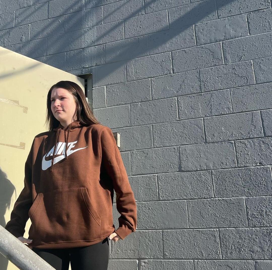 Woman in Nike hoodie