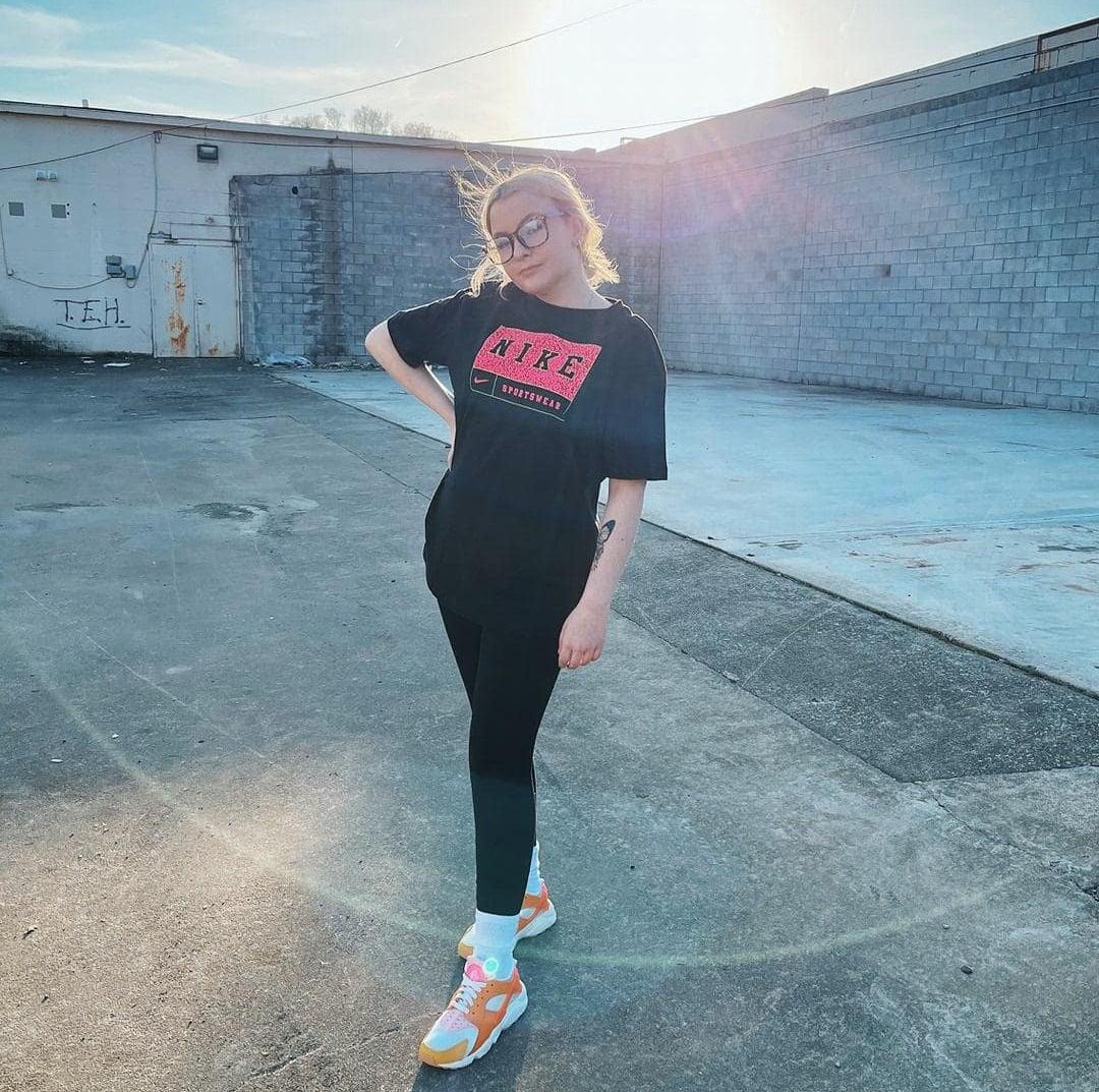 Woman in Nike apparel and sneakers