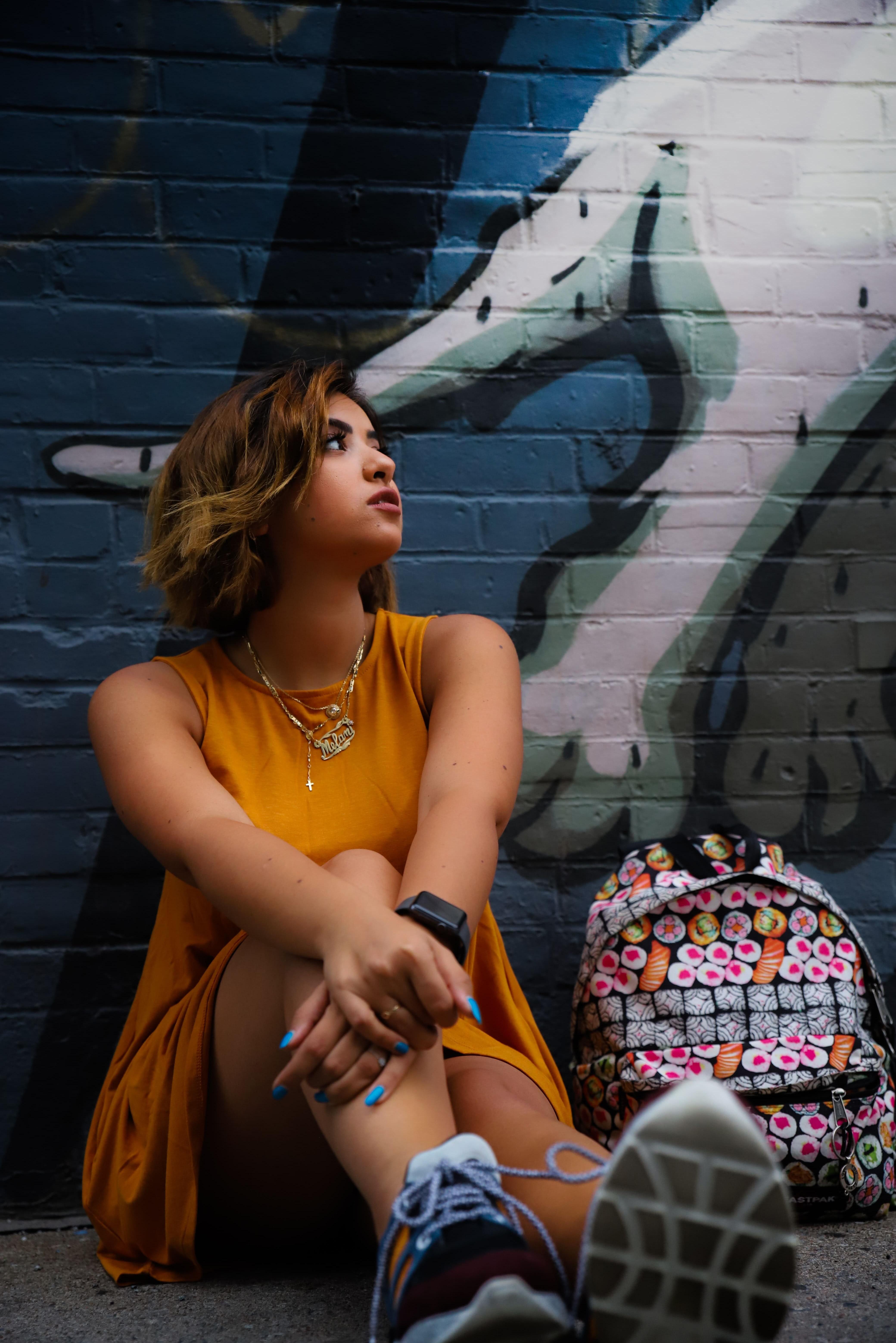 Woman in dress and sneakers