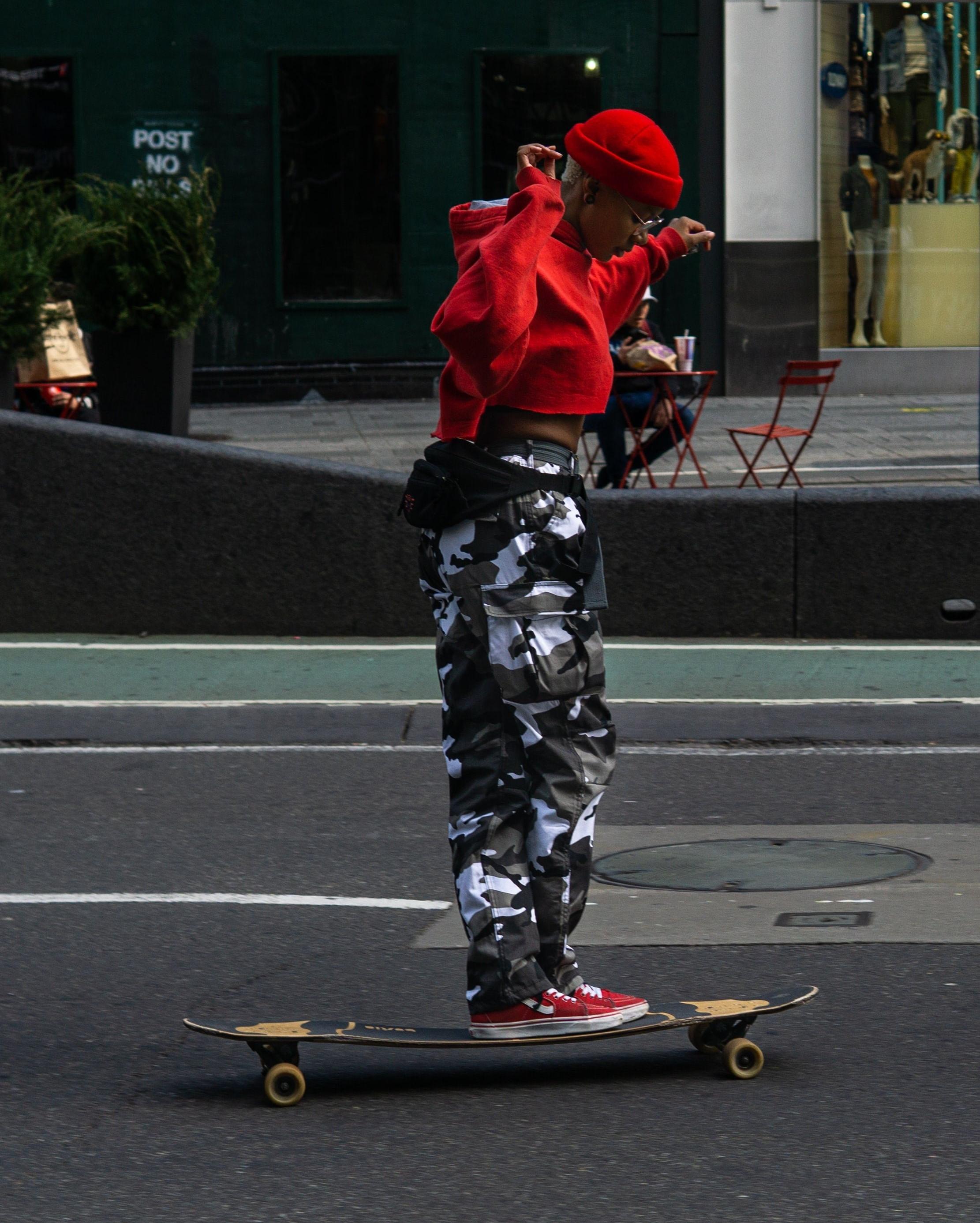women in pants and cropped hoodie