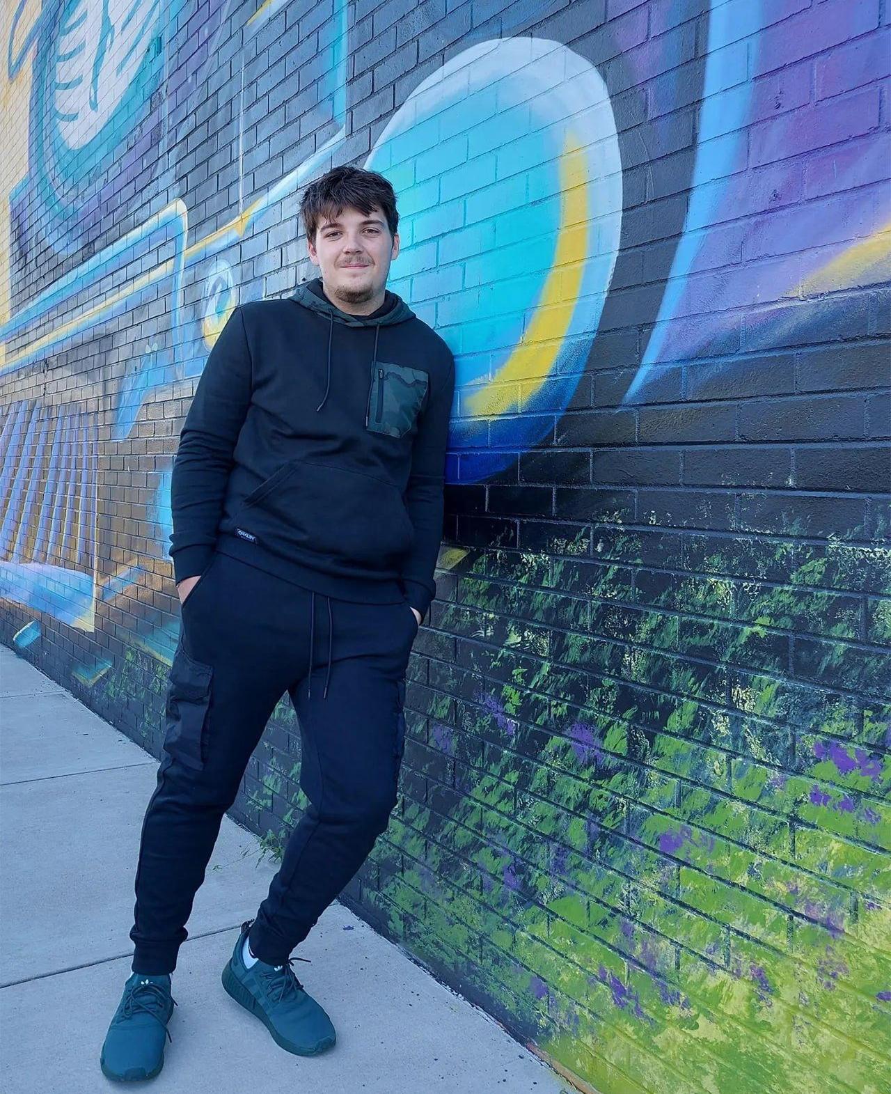 Man in Oakley Cargo Pants and Oakley Hoodie