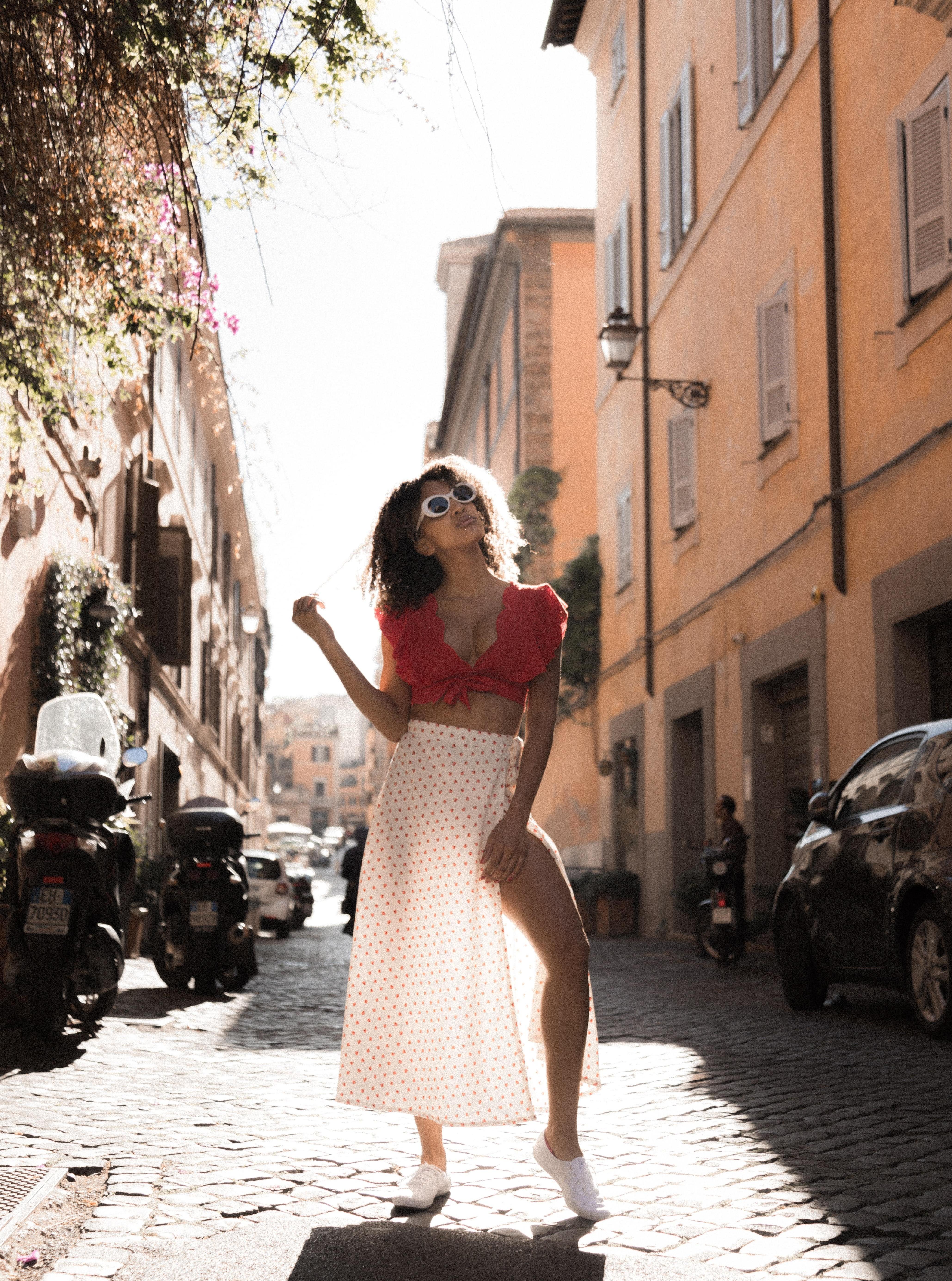 Woman in Polka Dot Skirt and White Sneakers