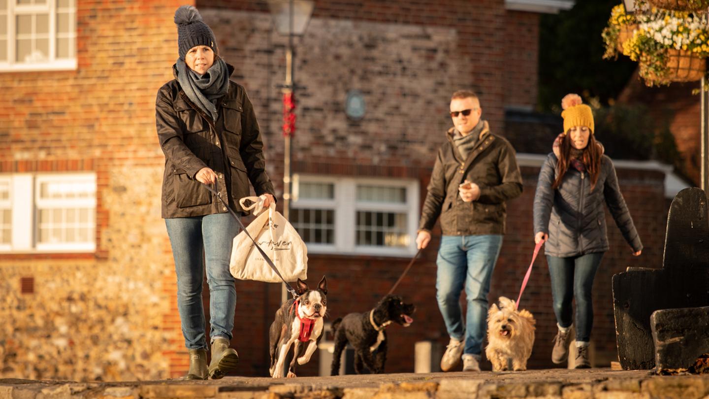 Some of the crew from FatFace HQ, wrapped up in coats and cosy accessories on a beautiful coastal dog walk