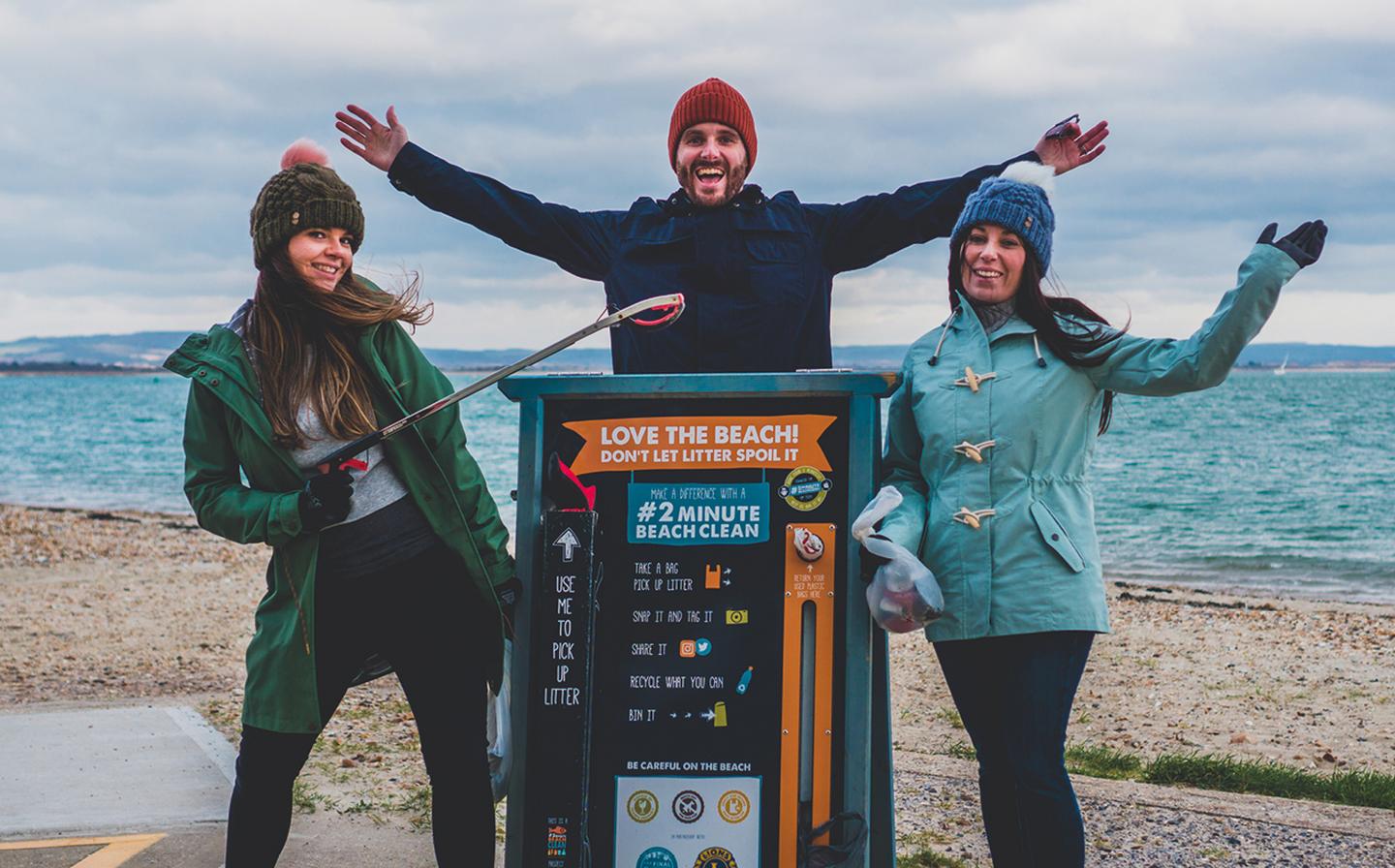 The team celebrate a successful beach clean by the 2 Minute Beach Clean station on Hayling Island