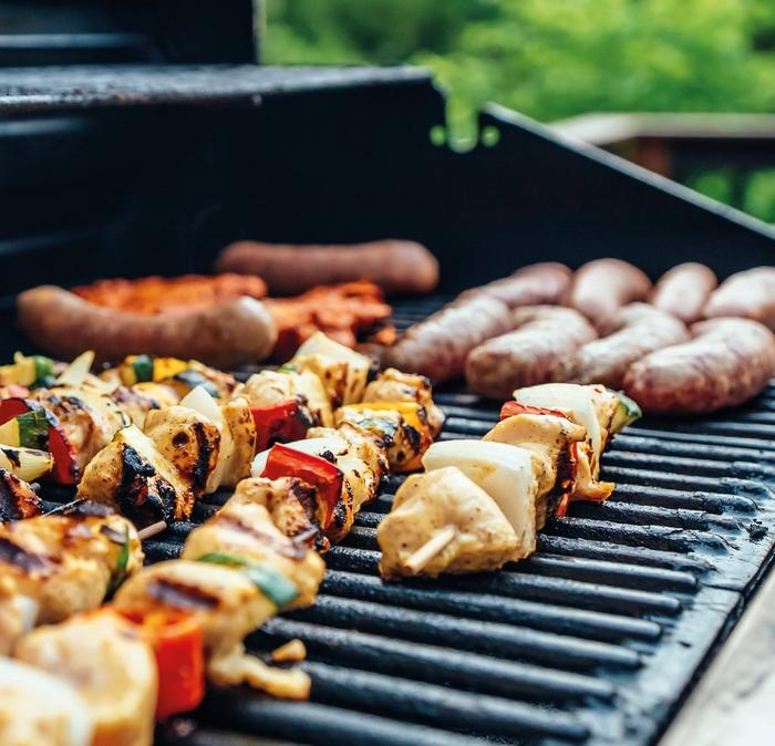 A BBQ filled with delicious looking food