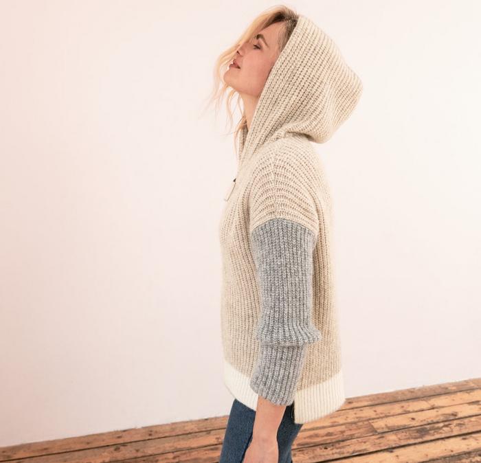 A blonde female model wearing the Lola Colour Block Hoody, part of the stylist edit by Angie Smith