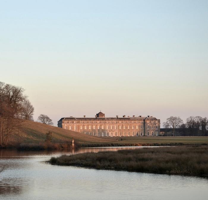 The majestic Petworth House overlooking a moat