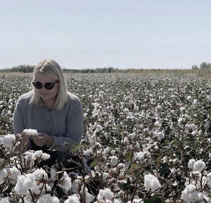 Responsible sourcing coordinator, Ayesha, visiting cotton fields, where the cotton for our cotton products is harvested.