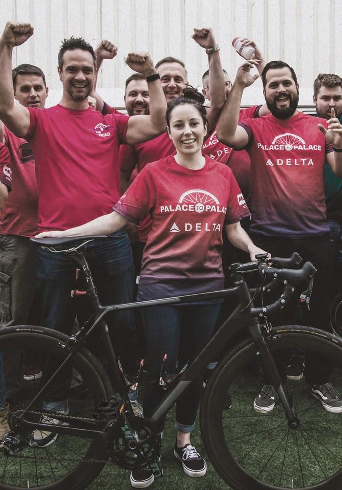 The FatFace team wearing red Palace to Palace jersey tops, who cycled 45 miles each for charity.