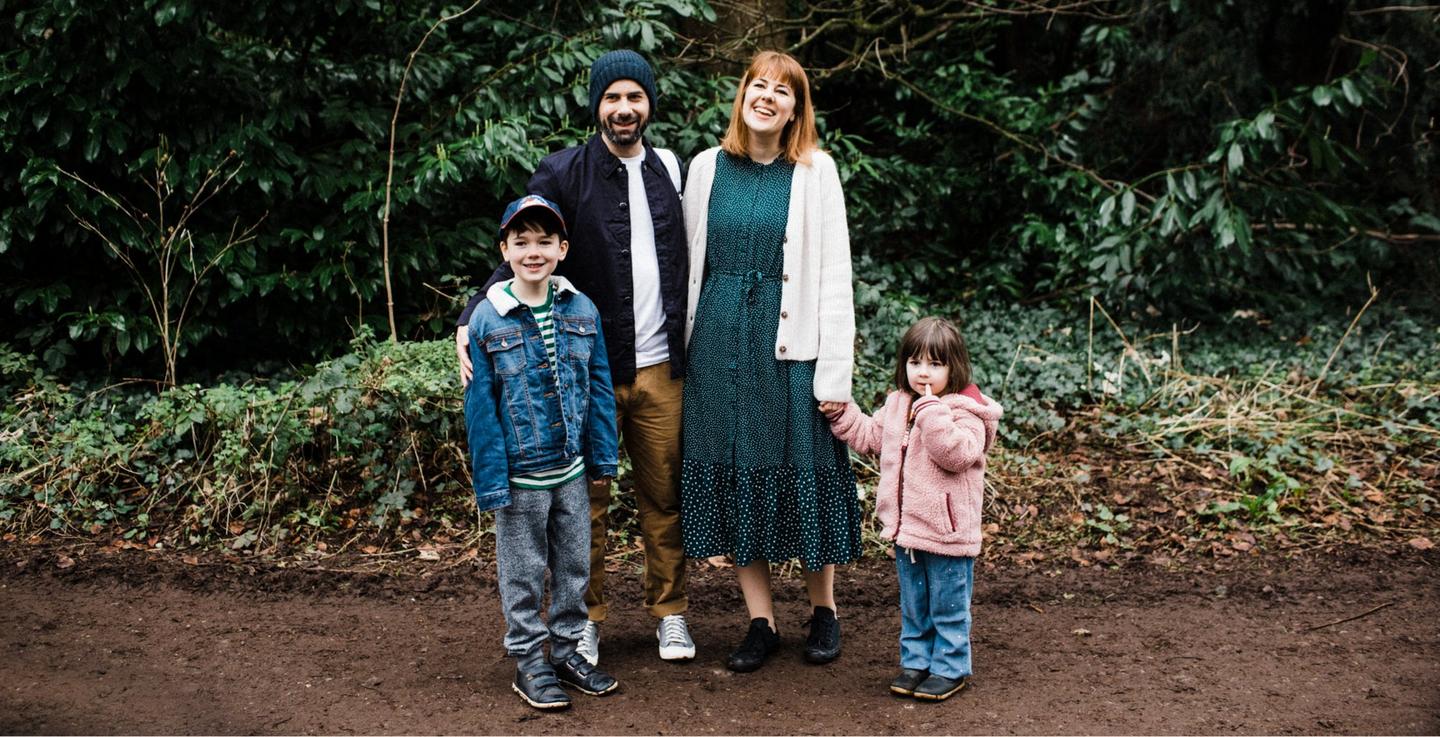 Lifestyle blogger @tigerlillyquinn and her family in the woods wearing FatFace clothing.