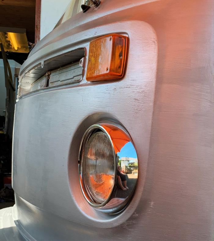The front headlights of a classic VW campervan.