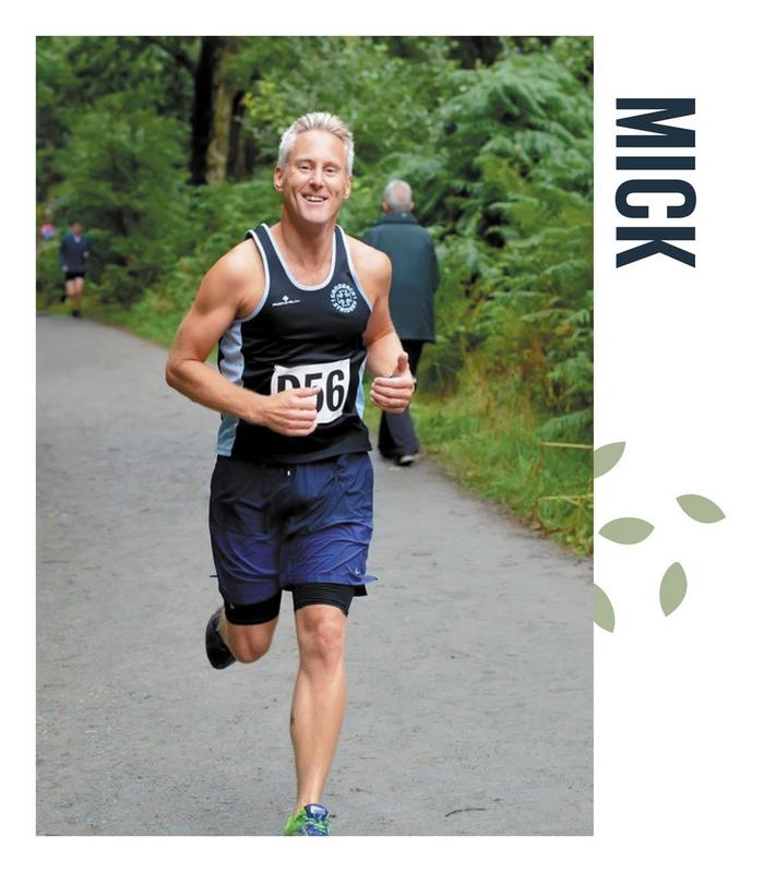 A family photo showing dad Mick smiling as he takes part in a running event.