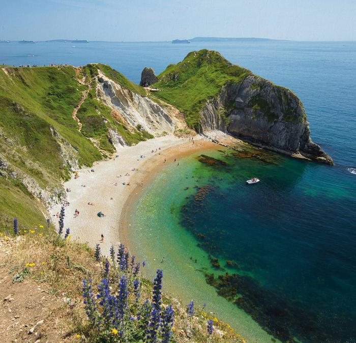 A beautiful sheltered bay with a sandy beach on the Jurassic Coast.