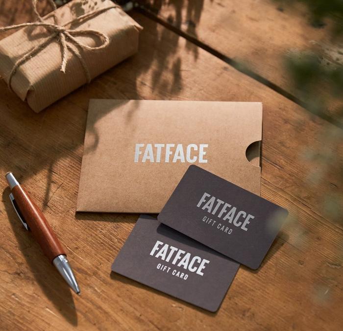Two slate-grey FatFace gift cards & a simple cardboard sleeve, all with silver foil-print.