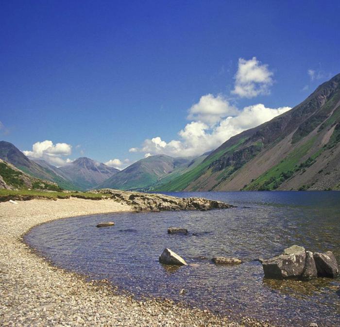 The breathtaking view of mountains under a blue sky, at the shore of Wastwater in the Lake District.