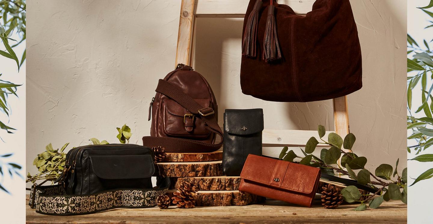 A selection of women's bags & purses in black, chocolate brown & tan brown leather & suede.