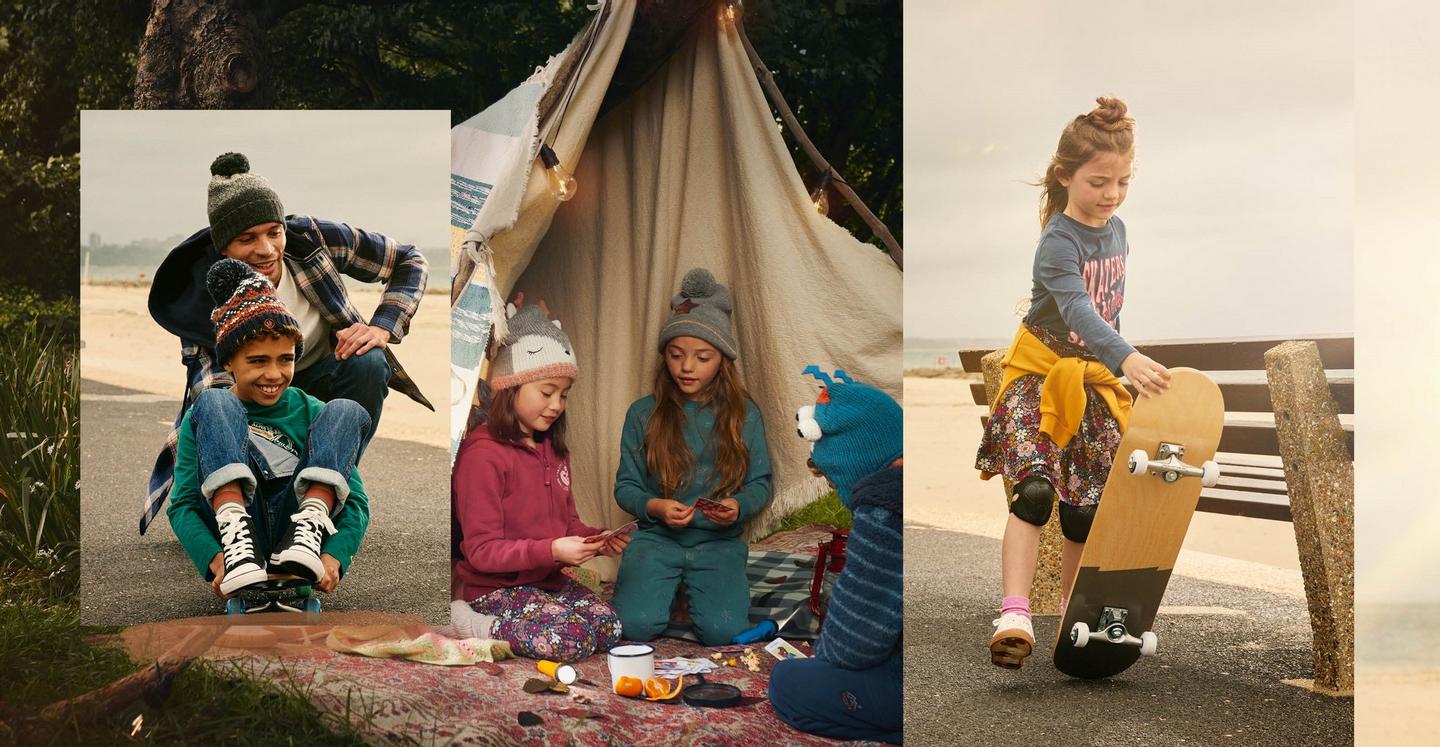 Kids dressed in warm clothes, skateboarding beside the beach & playing cards in a blanket fort outdoors.