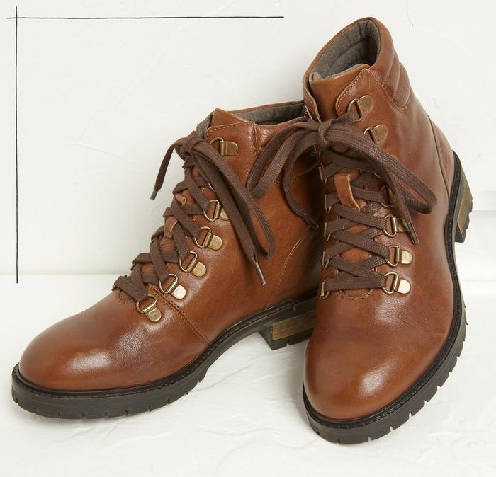 A pair of tan-brown leather lace-up walking boots for women.
