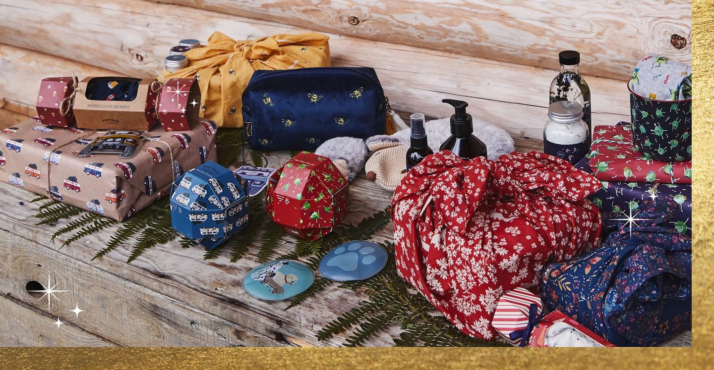 A selection of accessories & luxury toiletries, & gifts wrapped in recyclable paper & furoshiki-style fabric wraps.