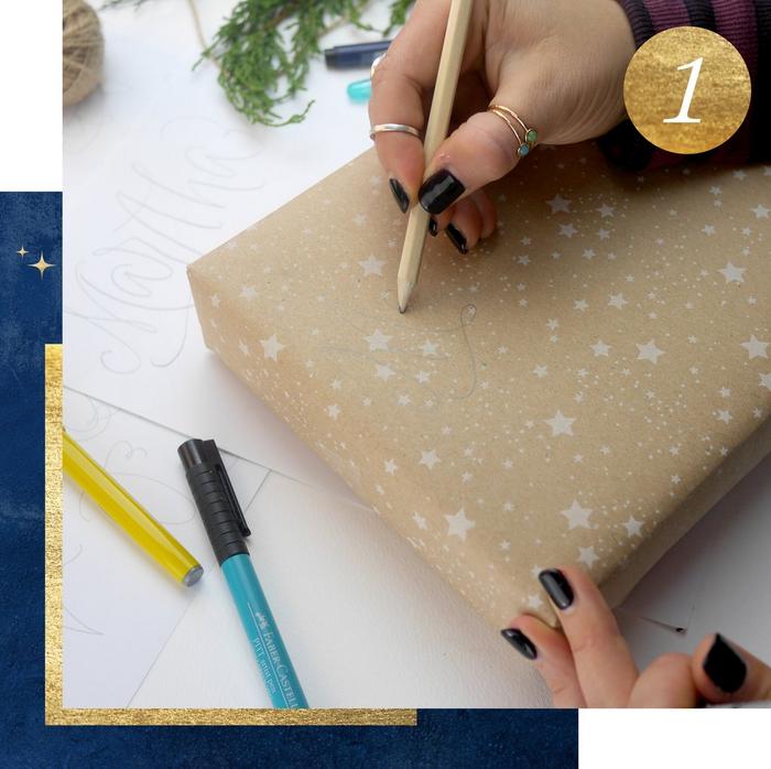 Step 1. A woman using a pencil to do calligraphy on a gift wrapped in recyclable paper.