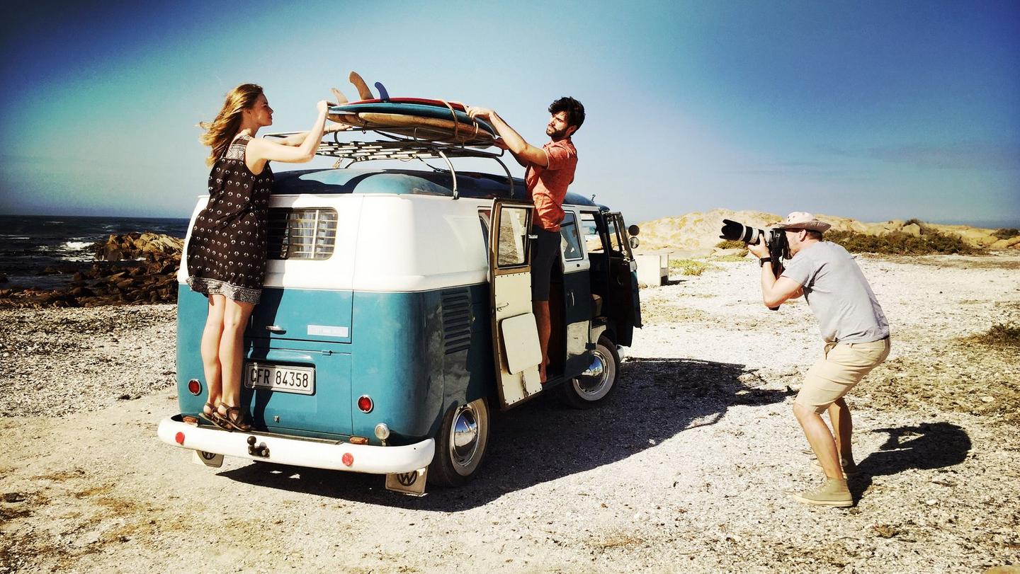 Two models loading up the campervan on our photoshoot