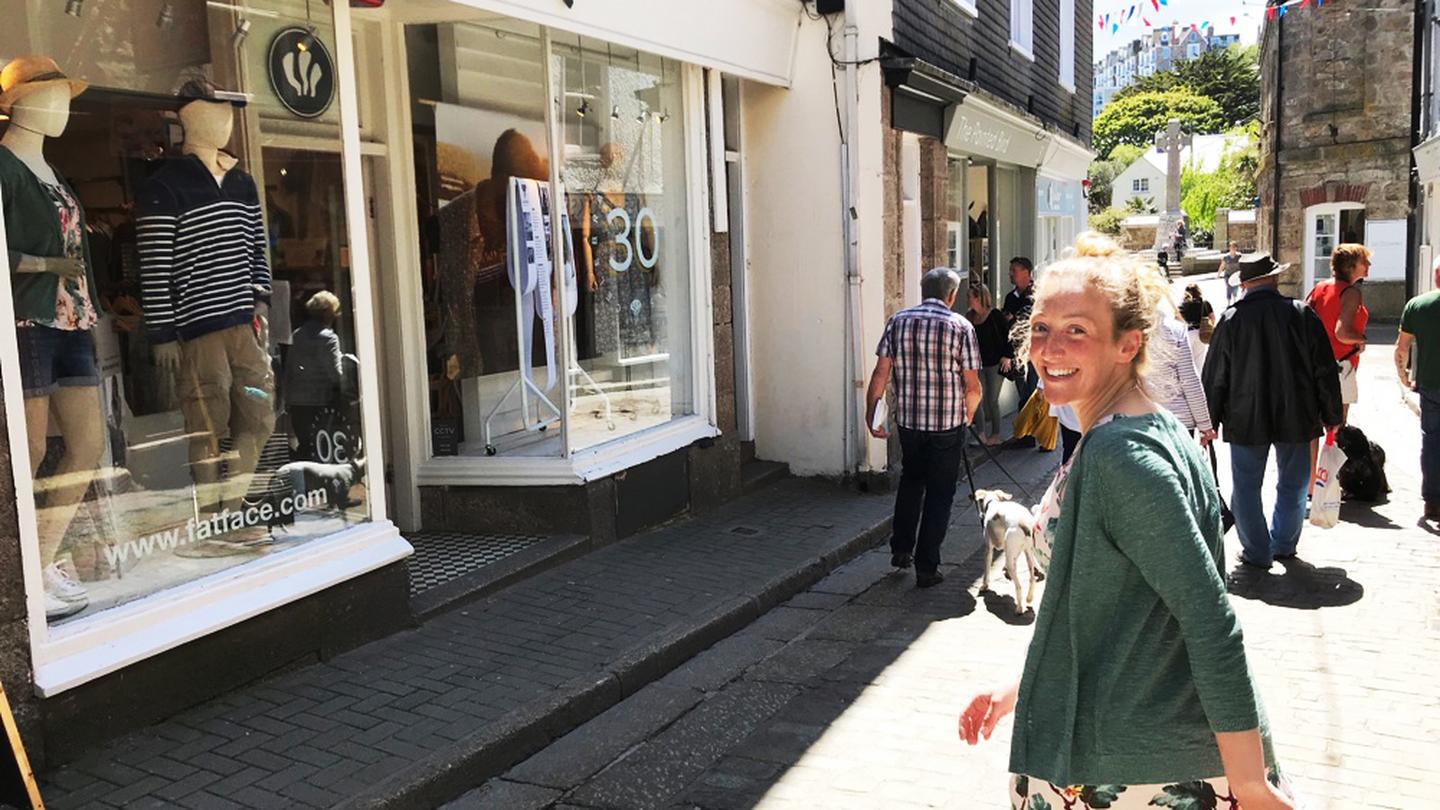 Poppy, who works at the St Ives FatFace store, taking a stroll down Fore Street where the store is located