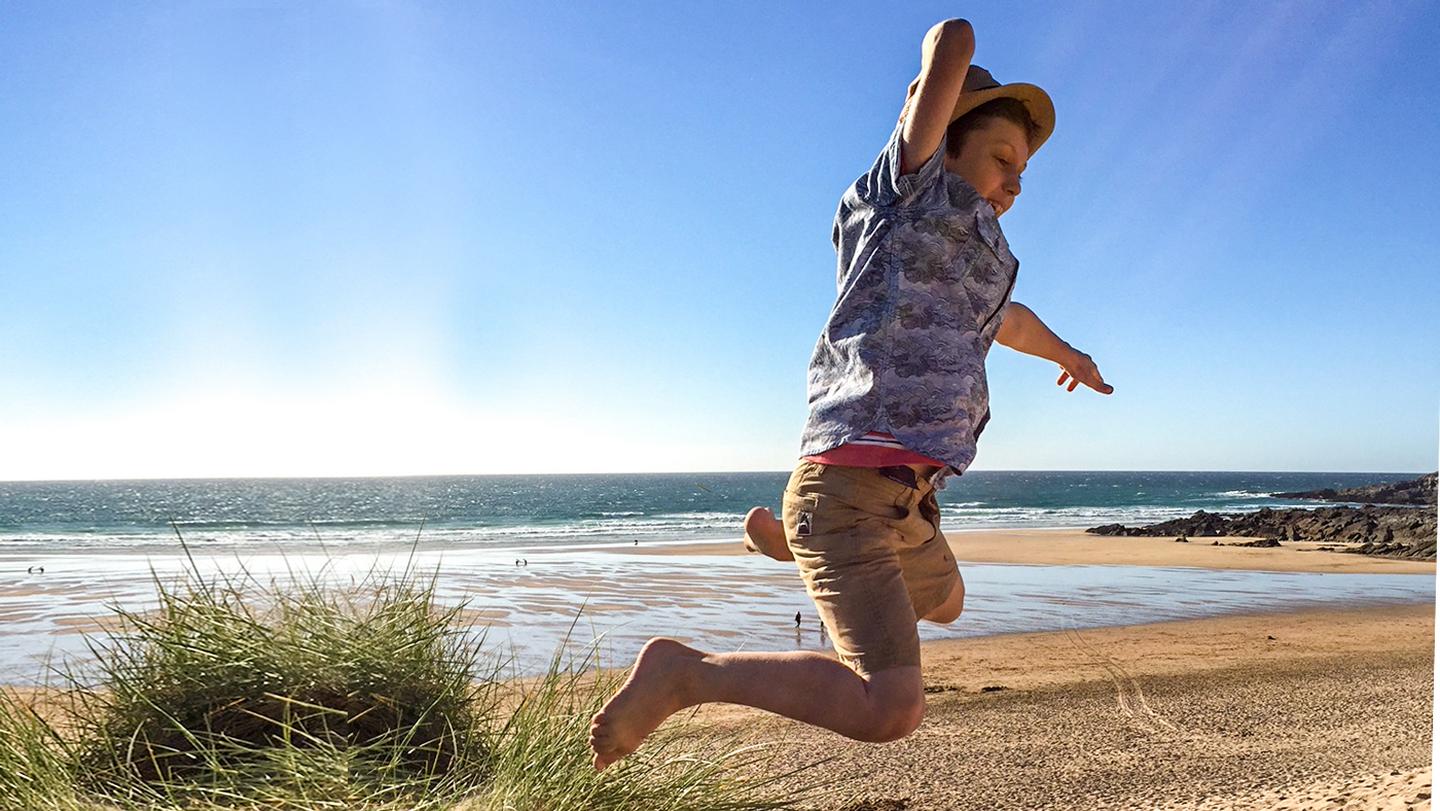 Store manager of the FatFaceFistral store's son, playing at Fistral beach wearing FatFace clothes