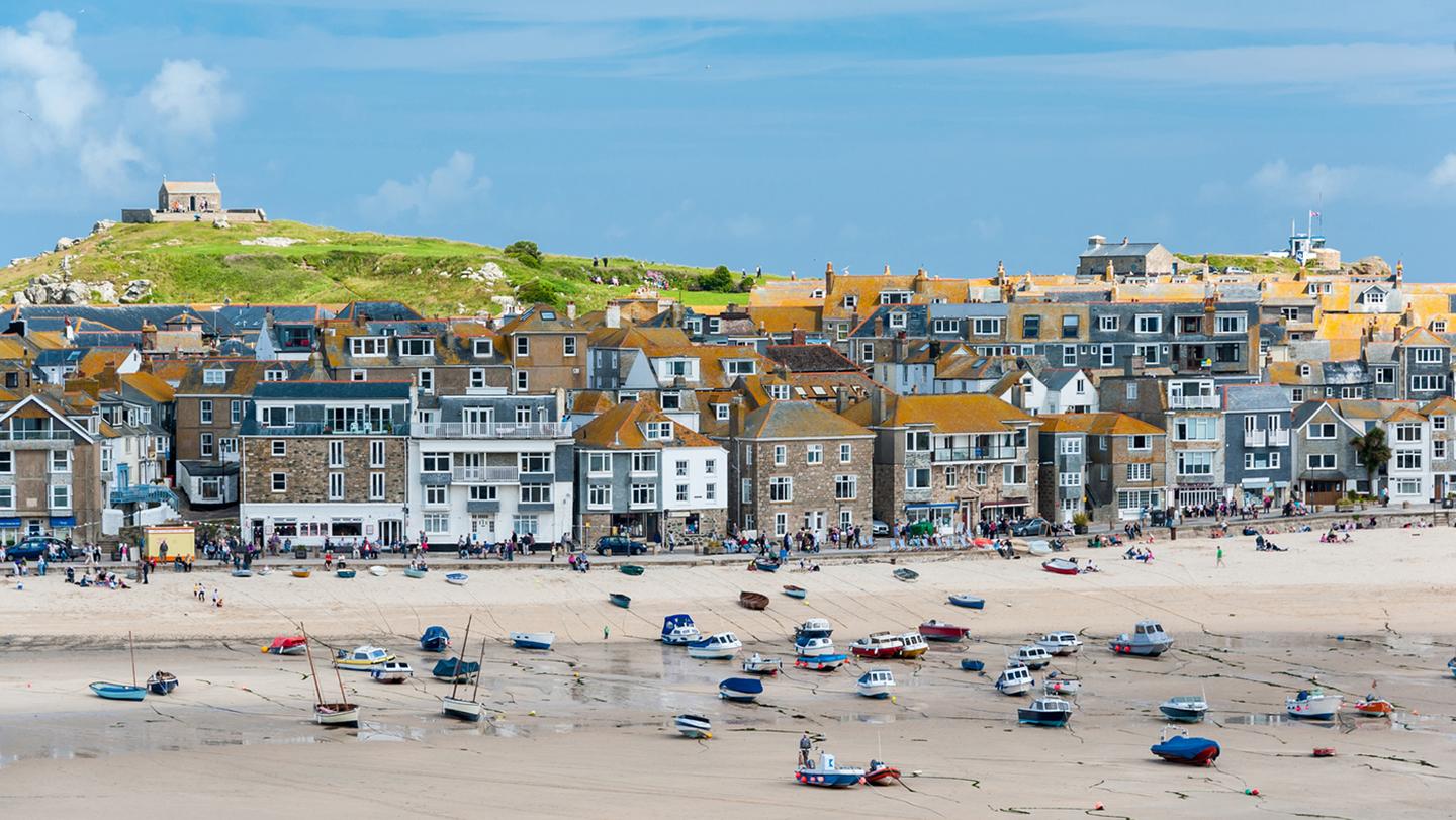 The beautiful town of St Ives, with sandy beaches, sailing boats and tall, colourful houses