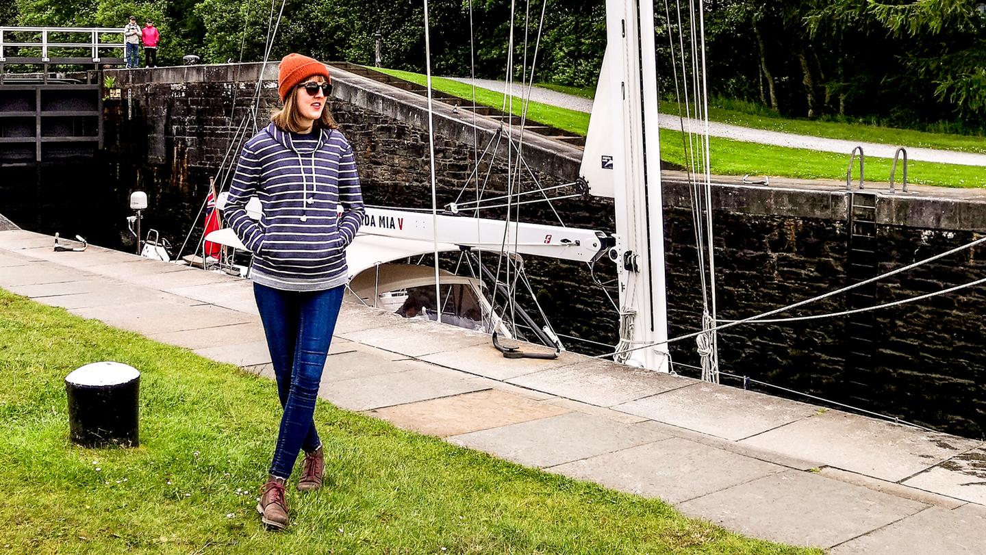 Rachel, store manager at the FatFace store in Fort William, stands by the waterside at Fort William wearing FatFace clothes