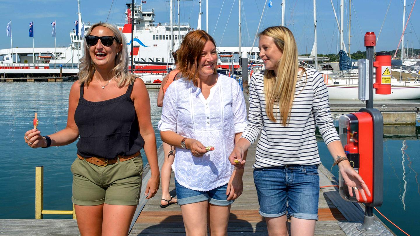 Crew from the FatFace store in Cowes, enjoying a day out by the water wearing FatFace clothes.