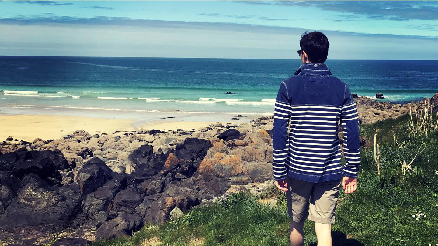 Daniel, who FatFace at the St Ives FatFace store, taking a stroll along the beach in a FatFace Airlie Sweat