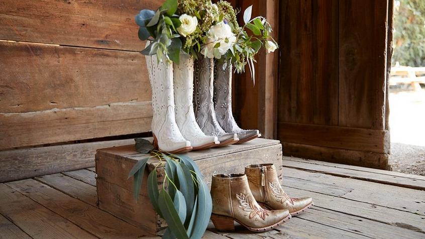 three pairs of wedding cowboy boots