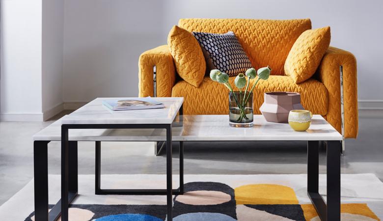 Quilted mustard chair with marble coffee table
