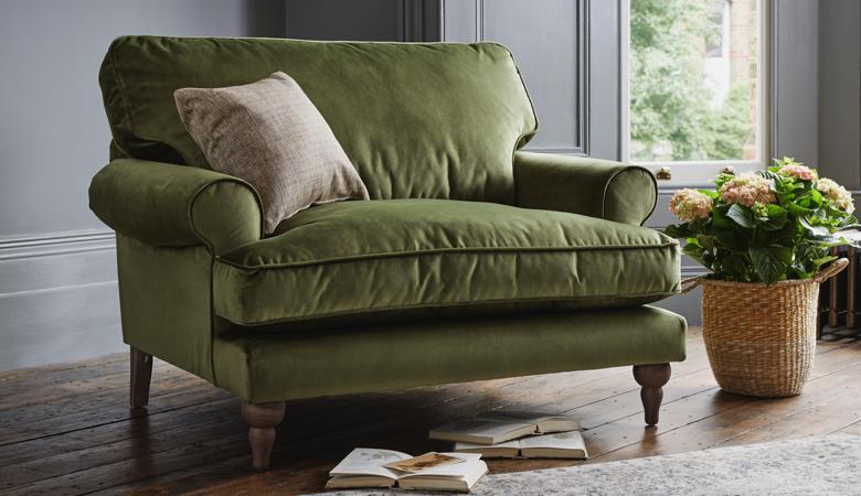Green velvet chair, pot plant, cushion