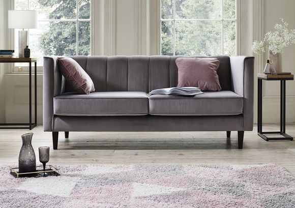 Grey sofa with pink accents