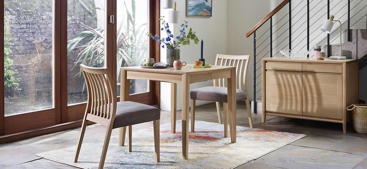 Light oak small dining table with slat back chairs