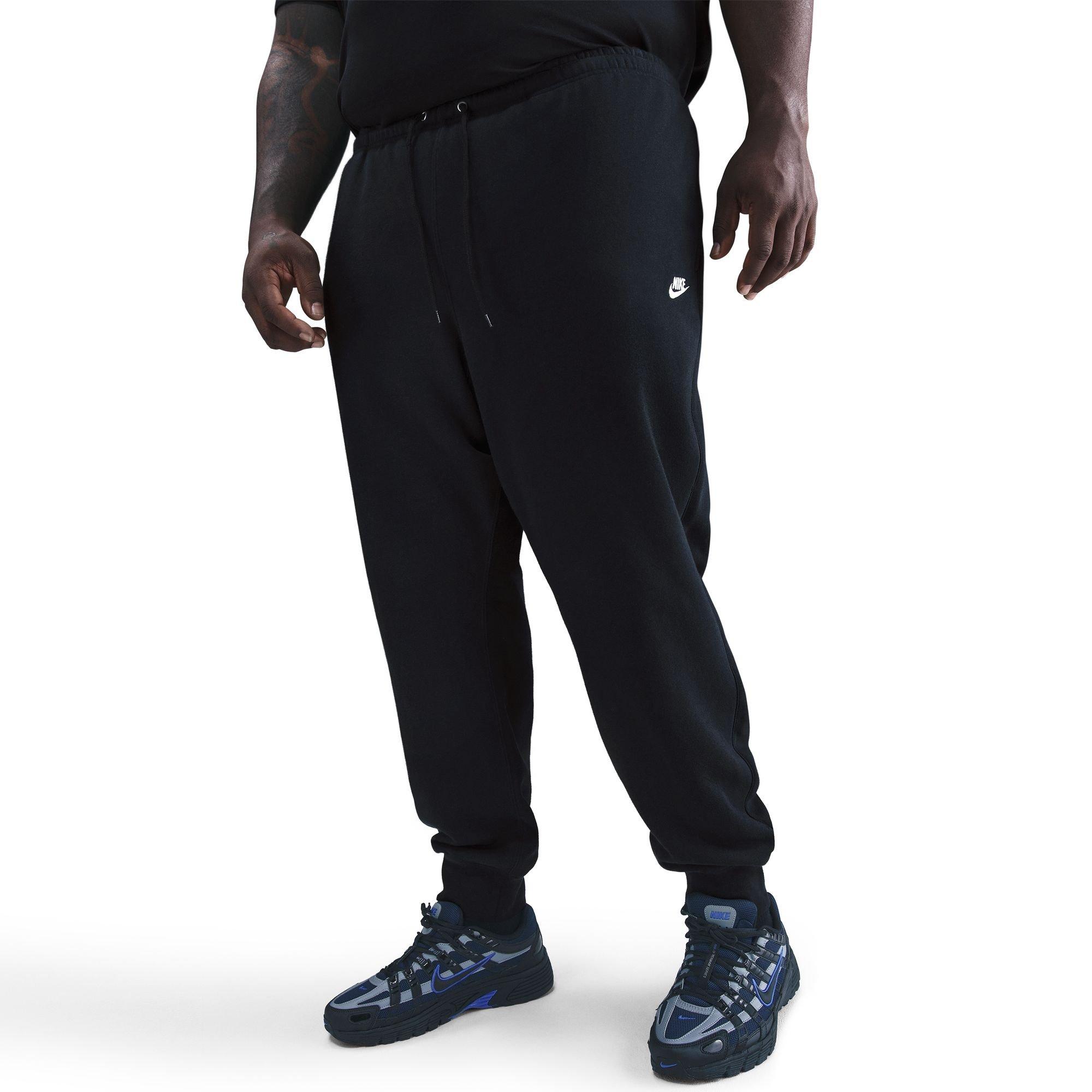 Men's Nike Club Joggers in black with drawstring waist, visible Nike Swoosh and Futura logo on thigh