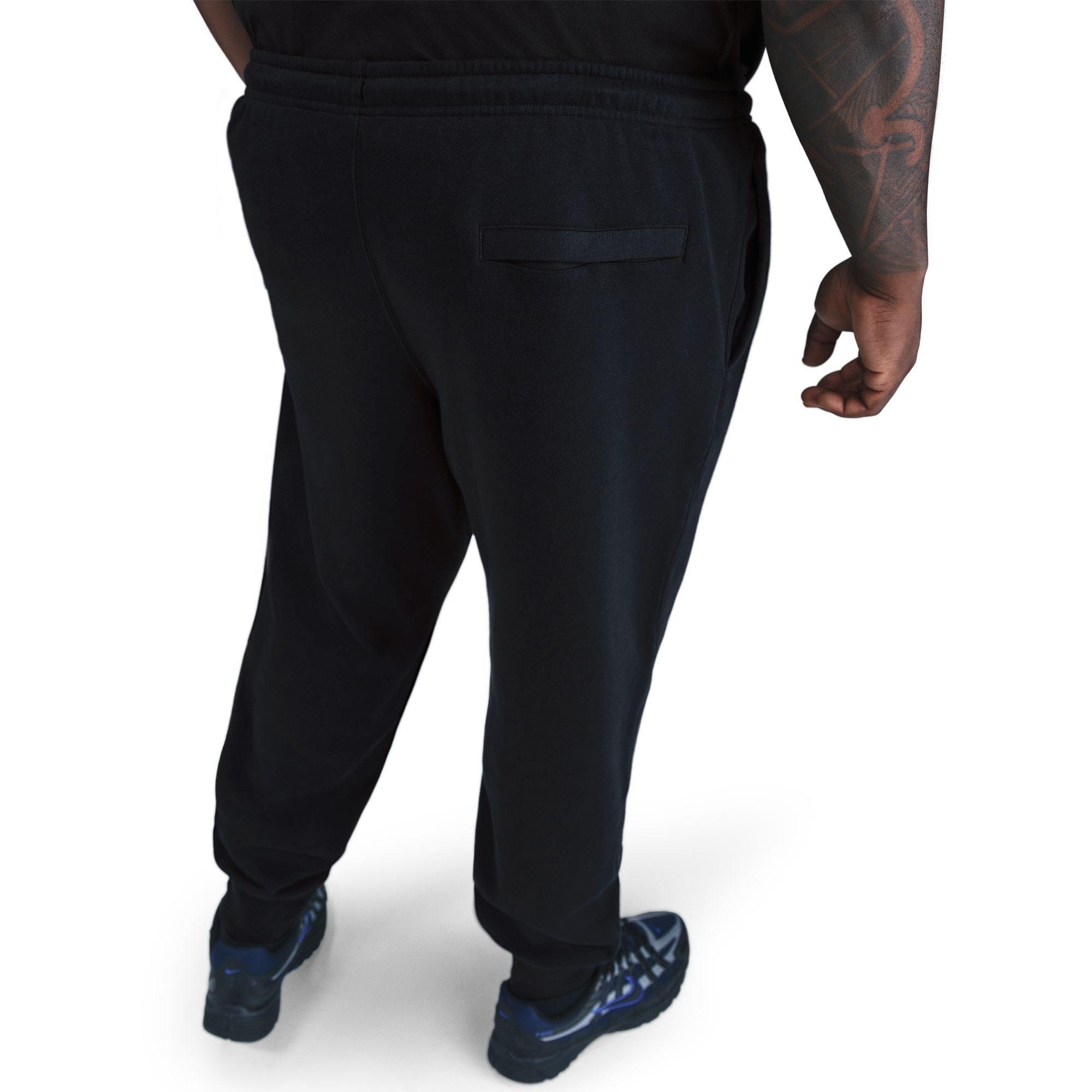 Back view of men's Nike Club Joggers in black showing ribbed cuffs and back pocket detail