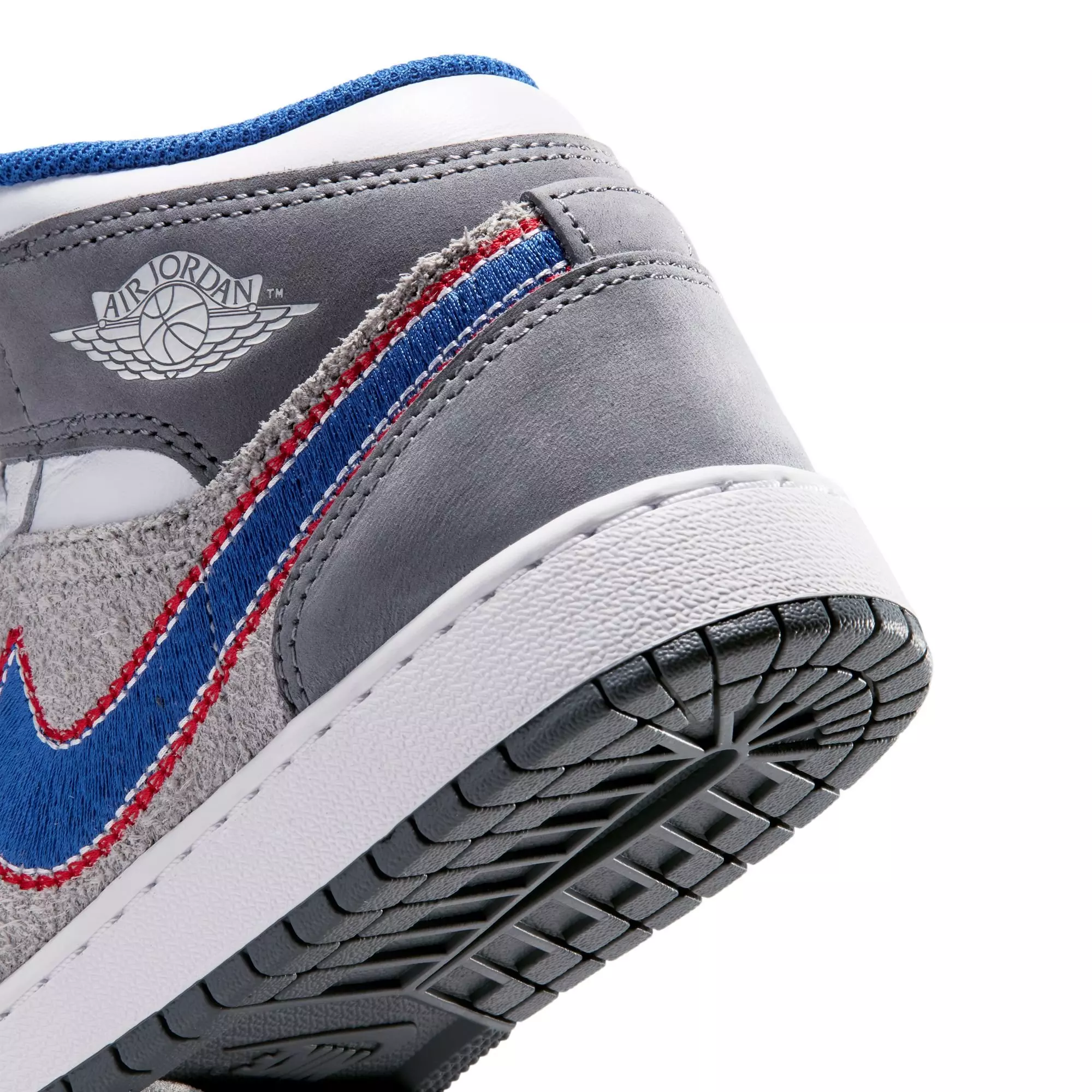 Jordan 1 Mid SE "Hare" Grade School Kids' Shoe - LT SMOKE GREY/VARSITY ROYAL