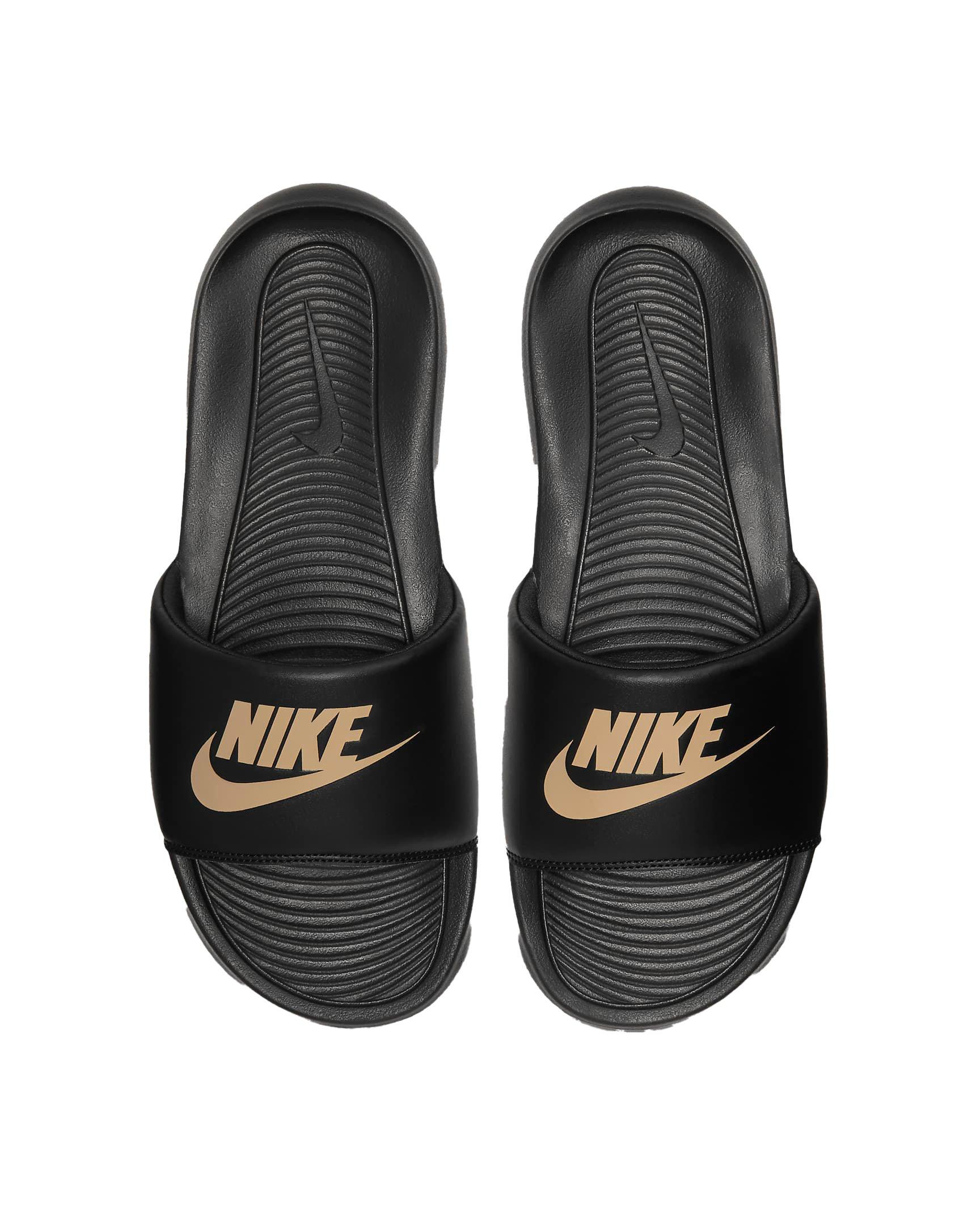 gold nike slides