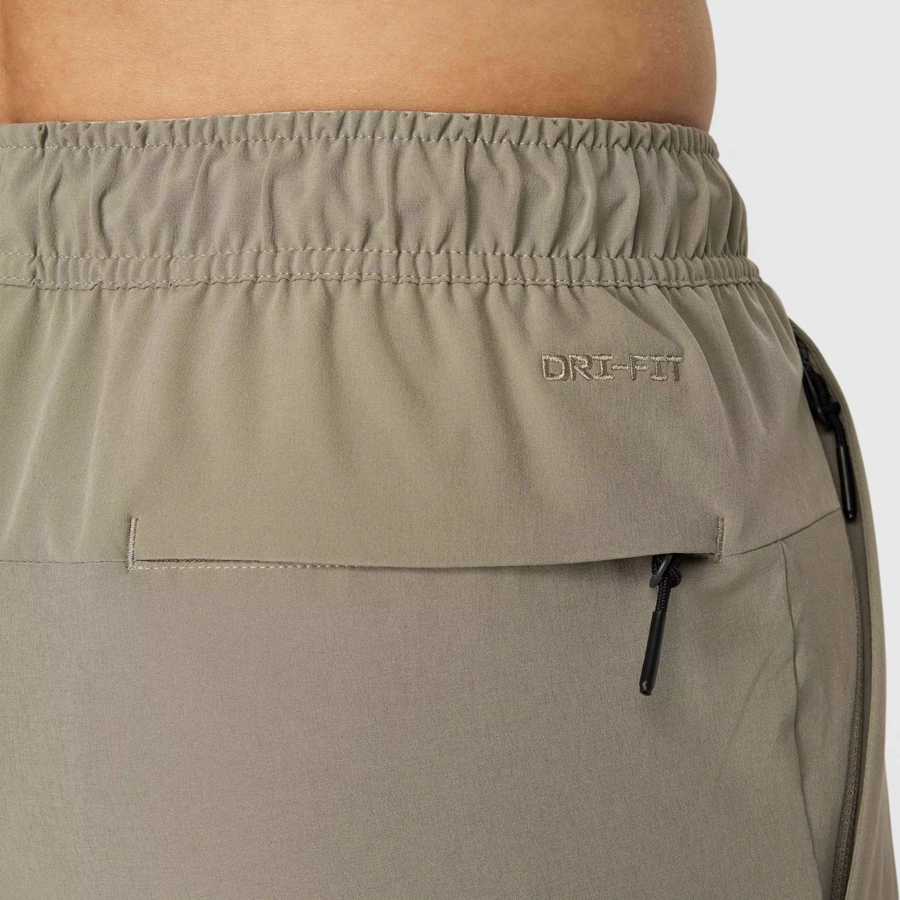 Nike Men's Unlimited Dri-FIT Zippered Cuff Versatile Pants - GREEN