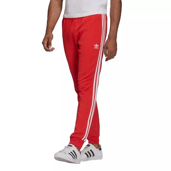 mulighed Ledningsevne Fremtrædende adidas Originals Men's Adicolor Classics Primeblue SST Track Pants - Red